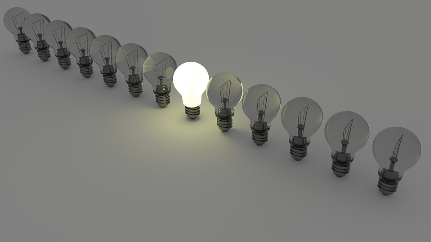 image showing a row of light bulbs with the centre one lit 